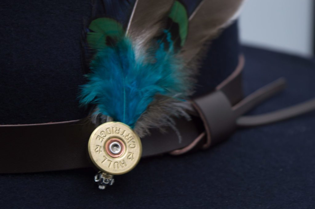 fedora crushable felt hat with leather trim and feather