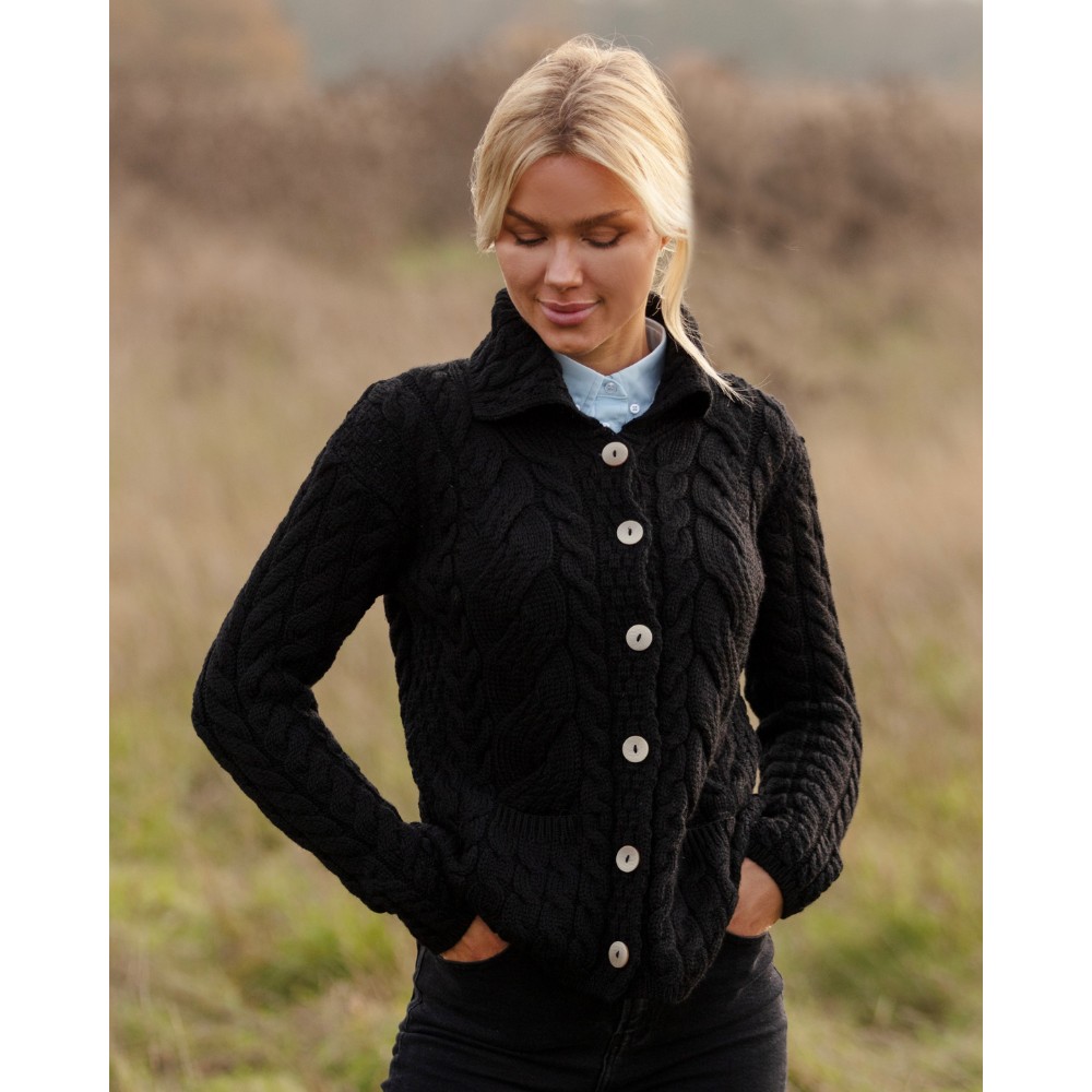 Female model wearing the Walker & Hawkes Harrison cardigan in black.