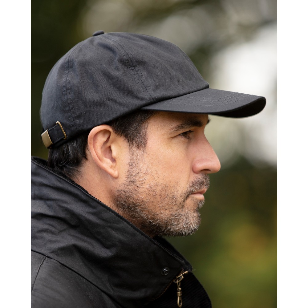 Male model wearing a Walker & Hawkes Bransford baseball cap in black.