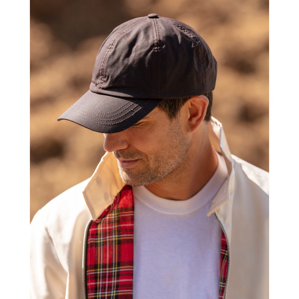 Male model wearing a Walker & Hawkes Bransford baseball cap in brown.