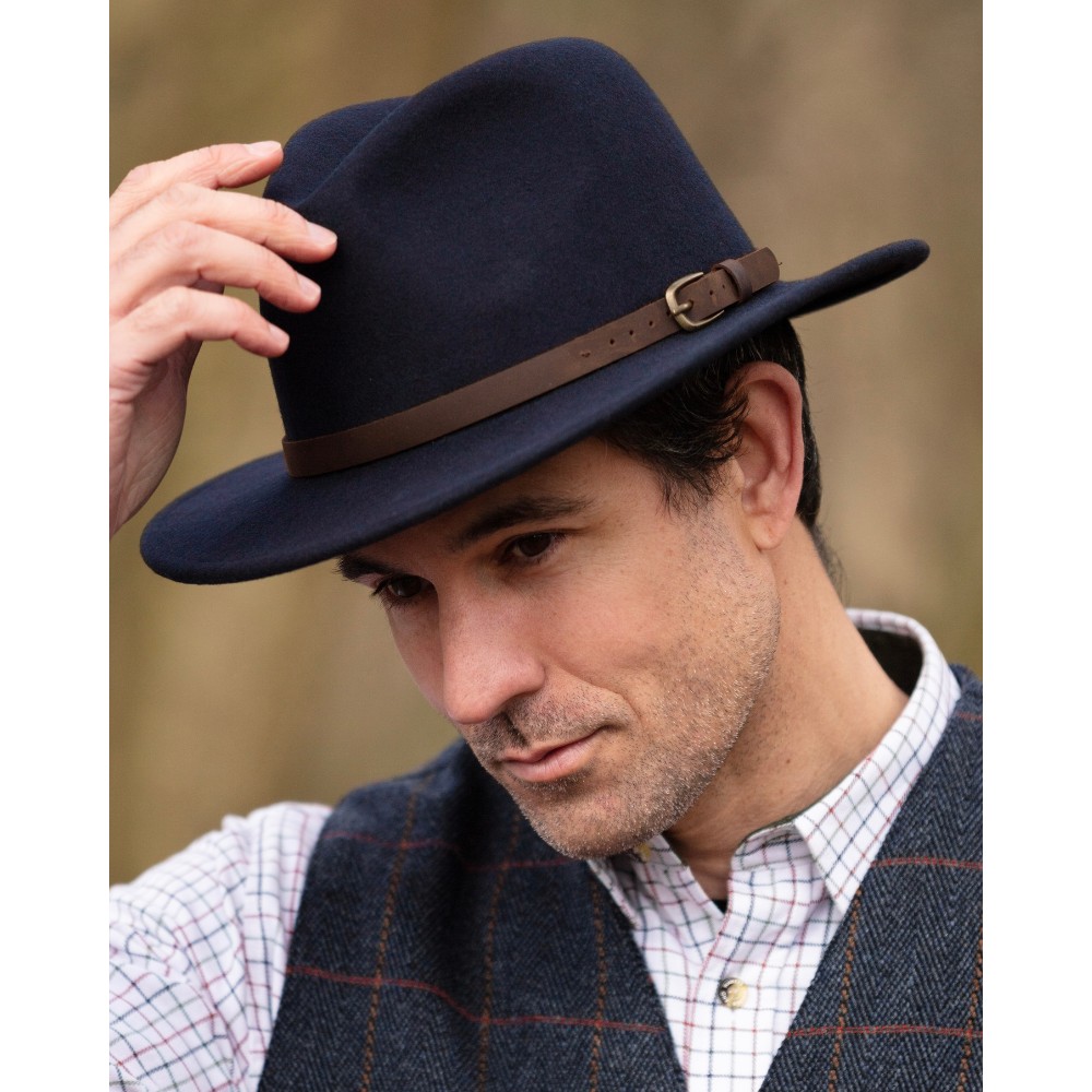 Male model wearing the Walker & Hawkes Wool Felt Dalby Outback Hat in navy.