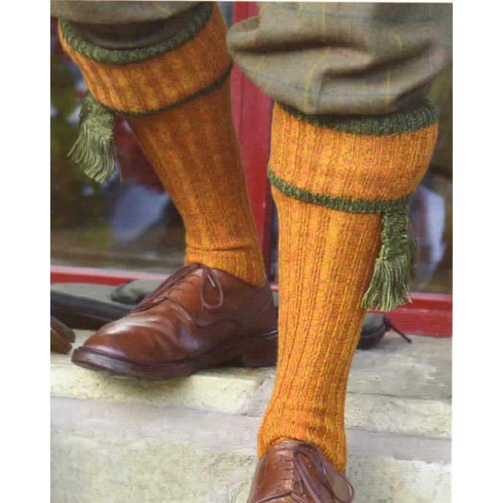 Male model wearing plus fours and Mens' Merino Wool Kyle Shooting socks with garter ties, in wild broom and Scots pine.