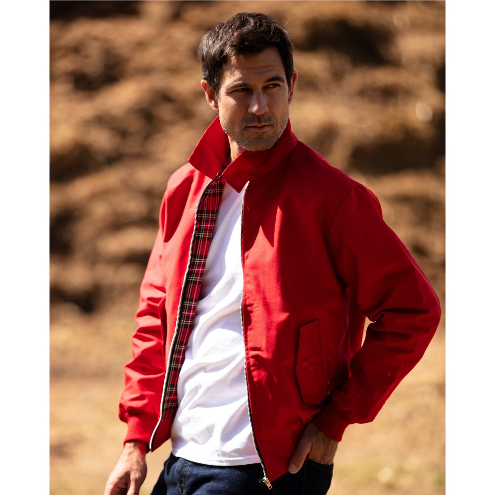 Male model wearing a Walker & Hawkes Harrington jacket in red.
