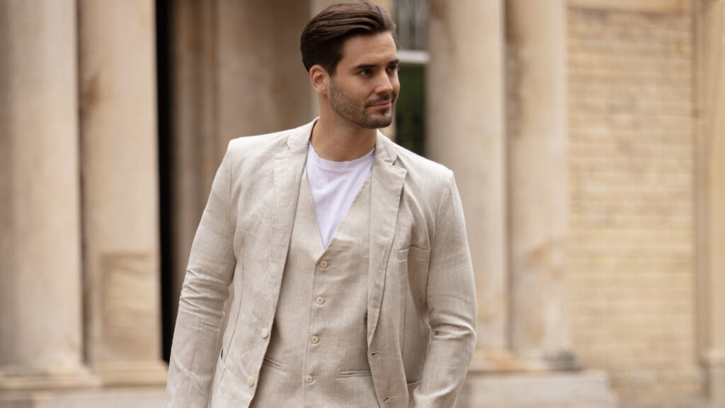 Man in a light coloured linen suit.