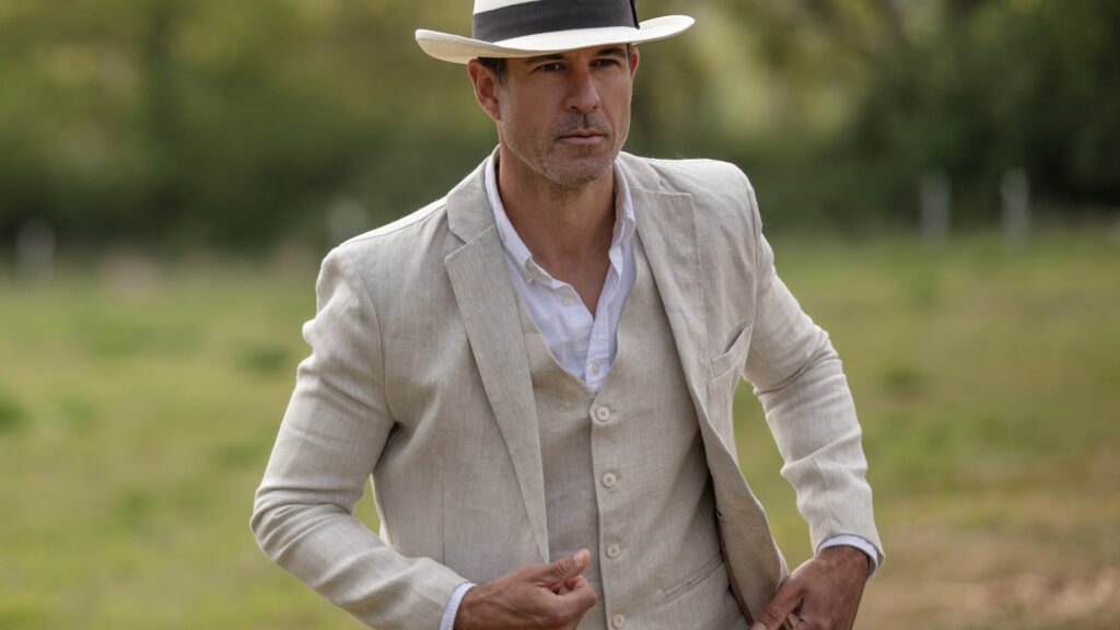 Sharply dressed man wearing the Brambridge blazer from Walker & Hawkes.